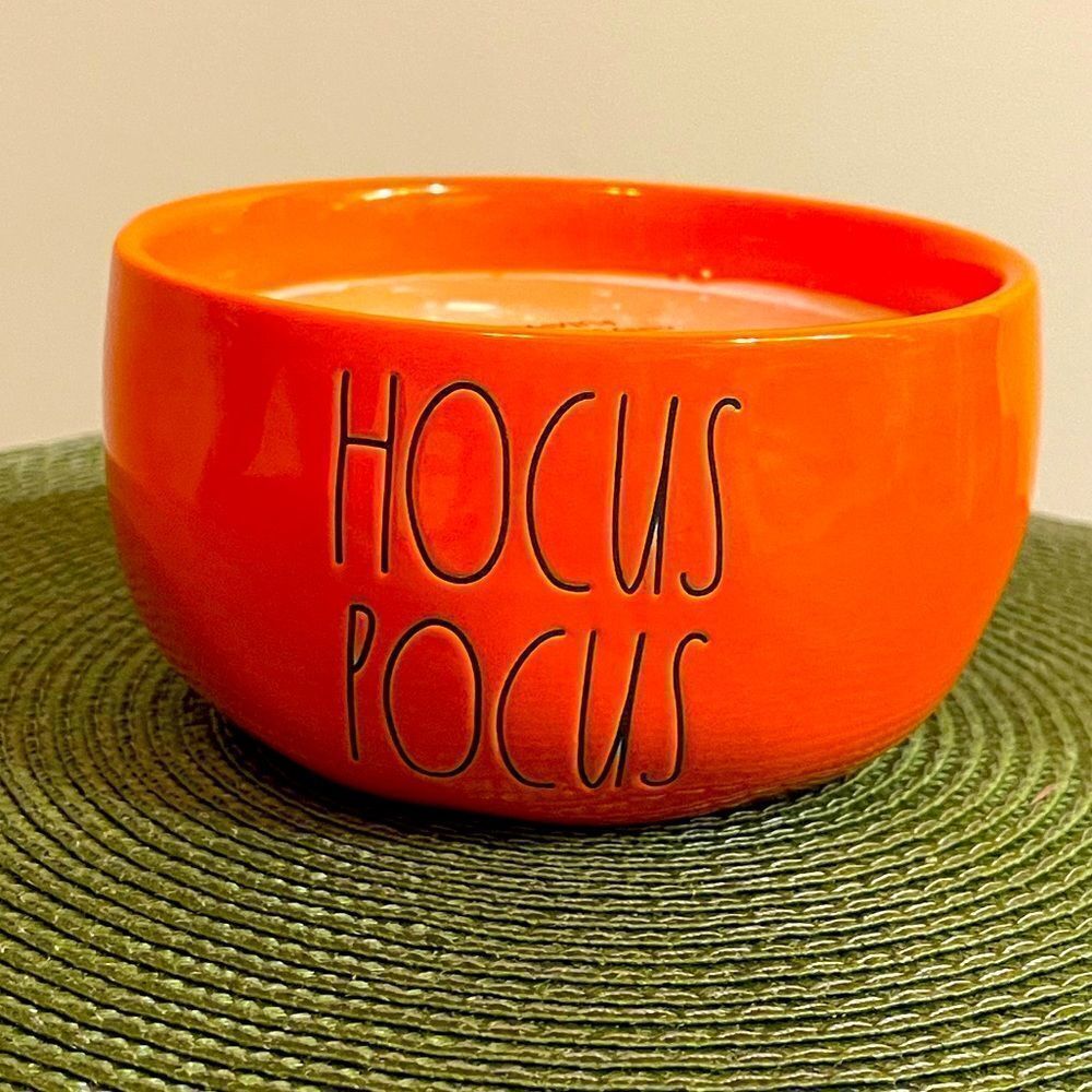 Rae Dunn ceramic orange scented candle with Hocus Pocus on the side NWT